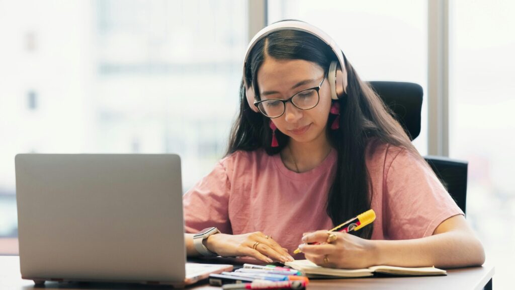 A prospective international student reviewing public university global rankings and post-study work visa policies alongside an ethical study abroad consultant in Bangalore.