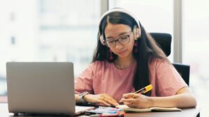 A prospective international student reviewing public university global rankings and post-study work visa policies alongside an ethical study abroad consultant in Bangalore.